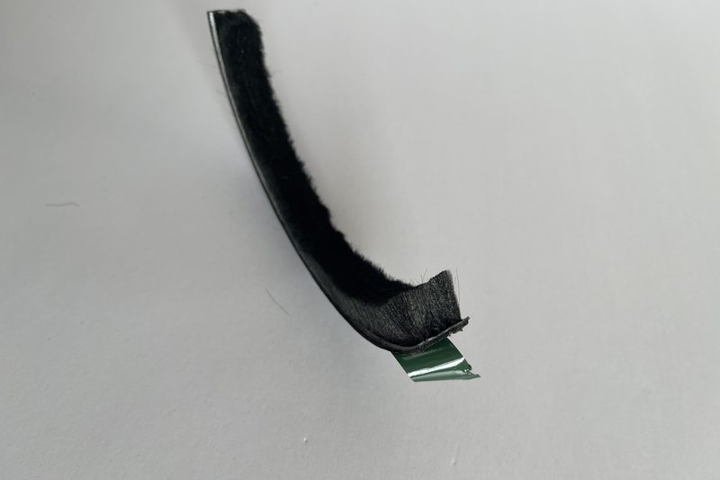 Release liner peeled back to show the foam carrier under the backing.
