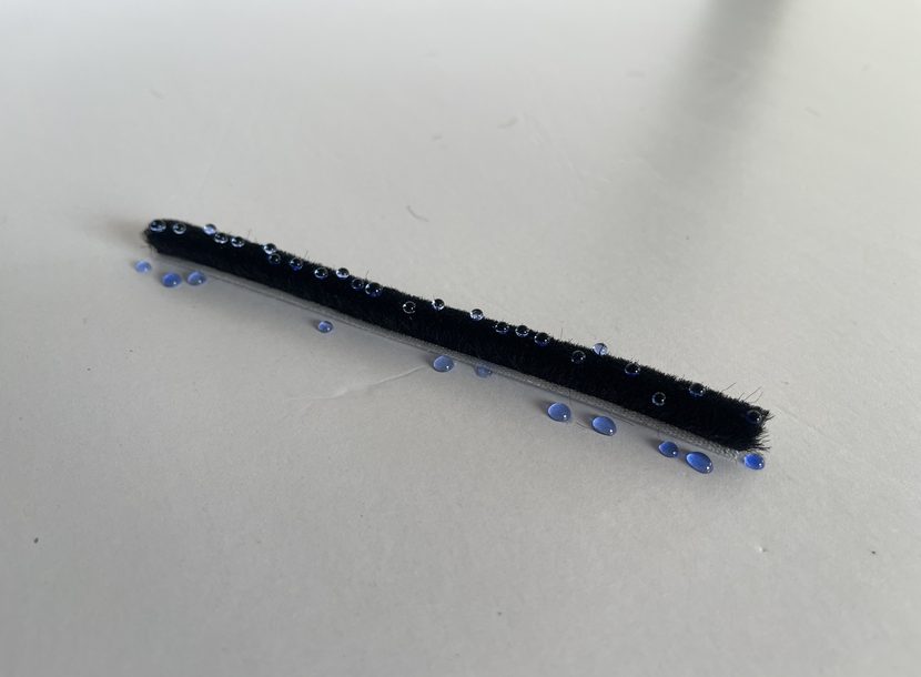 Water beading on the surface of silicone-treated pile instead of soaking into it.